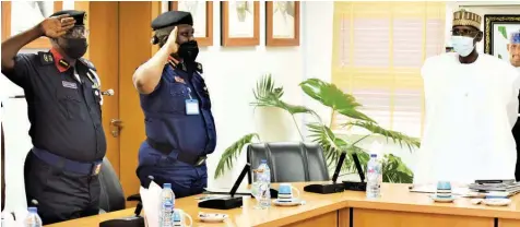  ?? PHOTO: LUCY LADIDI ATEKO ?? Nigeria Security and Civil Defence Corps ( NSCDC) Commander, Federal Capital Territory ( FCT), Dr. Peter Maigari ( left); NSCDC Zonal Commander, Zone O, Obiageli Obiajulu and FCT Minister, Muhammad Bello, during a visit to the minister in Abuja… yesterday.