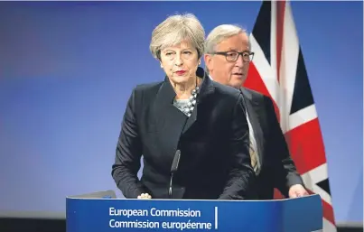  ?? Picture: AP. ?? European Commission President Jeanclaude Juncker behind Prime Minister Theresa May.