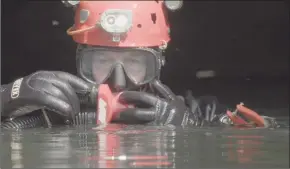  ?? Associated Press ?? The documentar­y film “The Rescue” chronicles the 2018 rescue of 12 Thai boys and their soccer coach, trapped deep inside a flooded cave.