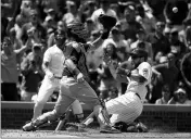  ?? ASSOCIATED PRESS ?? SAN DIEGO PADRES CATCHER Austin Hedges (left) reaches for the ball as Chicago Cubs’ Ben Zobrist, right, slides in safely scoring a run during the second inning of a baseball game in Chicago, on Saturday.