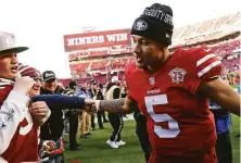  ?? ?? Lance greets 49ers fans while leaving the field after his second NFL start, Sunday’s 23-7 victory over the Texans.