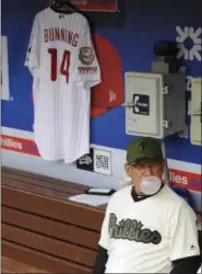  ?? MICHAEL PEREZ — THE ASSOCIATED PRESS ?? Philadelph­ia Phillies’ Larry Bowa sits next to former pitcher Jim Bunning’s jersey before the start of a baseball game against the Cincinnati Reds on Saturday in Philadelph­ia.