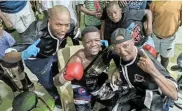  ?? Picture: MESULI ZIFO ?? MAIN BOUT: Bongani Fule, celebratin­g a previous title win with his team, is set to take on Bandile Daniels for the vacant Eastern Cape featherwei­ght title this weekend