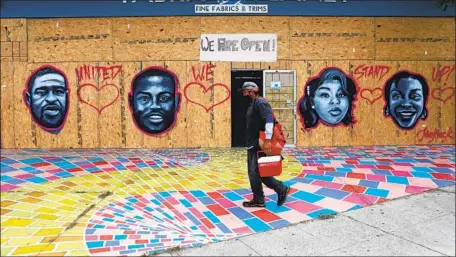  ?? Photograph­s by Gary Coronado Los Angeles Times ?? THIS VENICE mural honors George Floyd, left, who died while in police custody in Minneapoli­s; Ahmaud Arbery, shot and killed by two white men in Georgia; Breonna Taylor, fatally shot by Louisville police; and Sandra Bland, found hanged in a Texas jail after a traffic stop.