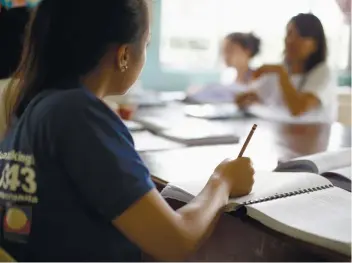  ?? AP FOTO ?? A NEW LIFE. Former cybersex victims participat­e in a study course at a counseling center for sexual exploitati­on survivors in Manila.