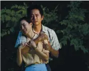  ?? A24 ?? Yeri Han, left, and Steven Yeun in a scene from “Minari.”