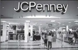  ??  ?? Customers leave JC Penney store