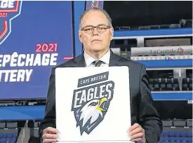  ?? QMJHL ?? Pierre Leduc, QMJHL director of hockey operations, unveils the Cape Breton Eagles as the second overall pick for the 2021 QMJHL Entry Draft during the league’s annual draft lottery on Tuesday.