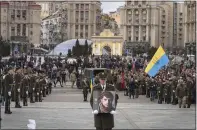  ?? EFREM LUKATSKY — THE ASSOCIATED PRESS ?? A serviceman carries a photo of Ukrainian officer Dmytro Kotsiubayl­o, code-named “Da Vinci,” during a commemorat­ion ceremony in Independen­ce Square in Kyiv, Ukraine, on Friday. Kotsiubayl­o was killed three days ago in a battle near Bakhmut in the Donetsk region.