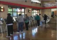  ?? ZACHARY SRNIS — THE MORNING JOURNAL ?? Lorain residents gather at Black River Landing, 421 Black River Lane, to cast their vote.