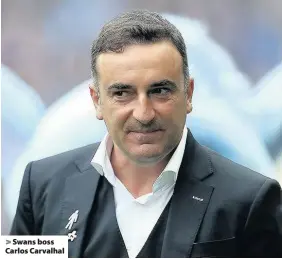  ??  ?? > Swans boss Carlos Carvalhal