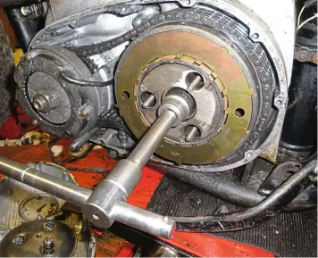  ??  ?? The special tool makes undoing the clutch centre nut (and the crankshaft nut) easy