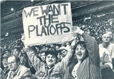  ?? ANDREW STAWICKI TORONTO STAR FILE PHOTO ?? Maple Leafs fans Bill and John Murray came all the way from Fredericto­n, N.B. to watch Toronto stay in the playoff hunt in 1989. In the 1980s, 16 of 21 NHL teams would play post-season hockey.