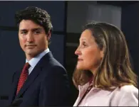  ?? AP/The Canadian Press/PATRICK DOYLE ?? Canadian Prime Minister Justin Trudeau listens as Canadian Foreign Affairs Minister Chrystia Freeland talks Thursday in Ottawa, Ontario, about U.S. tariffs.