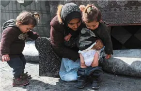  ?? ?? aid workers and medics say Gaza’s around 52,000 pregnant women are among those endangered by the collapse of the health system amid the ongoing war.