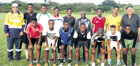  ??  ?? Coaches Milton Smith (back left) and Sheldon Hughes (back right) with some of the aspiring young soccer players hoping to make the cut for the team