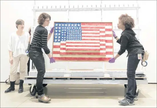  ?? Allen J. Schaben Los Angeles Times ?? ONE OF Jasper Johns’ most important works, “Three Flags,” is installed at the Broad as part of “Jasper Johns: ‘Something Resembling Truth,’ ” a survey of his work.