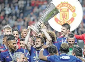  ?? Michael Sohn / Associated Press ?? Manchester United celebrates its Europa League championsh­ip, a victory dedicated to the victims of Monday’s bombing attack, with midfielder Ander Herrera saying, “It’s just a football game, just a trophy, but if we can support them with this just 1...