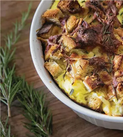  ??  ?? A breakfast strata is a perfect example of the “waste not, want not” philosophy. It is made with eggs, cheeese, bread, green onions, rosemary and other ingredient­s. It is a great way to extend the life of bread and other items.