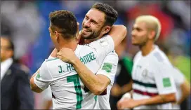  ?? HECTOR VIVAS / GETTY IMAGES ?? Javier Hernandez and Miguel Layun of Mexico celebrate following their side’s 2-1 victory in the Group F match Saturday against South Korea.