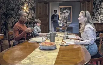  ?? Eike Schroter / Netflix ?? T'nia Miller as Hannah, from left, Benjamin Evan Ainsworth as Miles, Rahul Kohli as Owen, Amelie Smith as Flora, and Victoria Pedretti as Dani in the new Netflix series “The Haunting Of Bly Manor,” which premiers today.