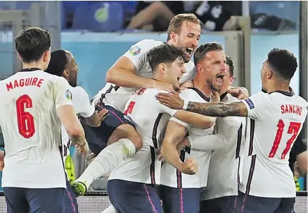  ?? Photo:: London Evening Standard ?? England football captain, Harry Kane (third from left), celebrates with his team-mates as they beat Ukraine 4-0 in the Euro 2020 quarterfin­al at the Stadio Olimpico in Rome, Italy, on July 3, 2021.