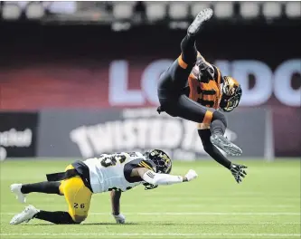  ?? CANADIAN PRESS FILE PHOTO ?? The Tiger-Cats signed defensive back Cariel Brooks, left, to a two-year contract extension Wednesday.