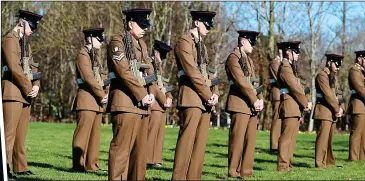  ??  ?? COMRADES IN ARMS: Soldiers at the funeral of Sir Tom, left. Below: A C-47 Dakota flies over