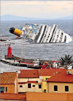  ?? EPA ?? The capsized ‘mega-ship’ Costa Concordia, as she lay outside the harbour of Giglio last week