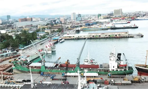  ?? SUNSTAR FOTO / ALLAN CUIZON ?? ALL CLEAR. Well, almost. Except for vessels that were bound for Iloilo, still on tropical storm Urduja’s path, all other boats were cleared to leave the port of Cebu as of Sunday.