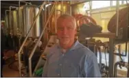  ?? BILL RETTEW JR. – DIGITAL FIRST MEDIA ?? Kevin Finn talks about the first major renovation at Iron Hill Brewery in West Chester.