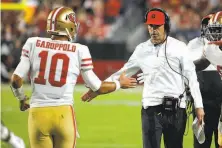  ?? Rick Scuteri / Associated Press 2019 ?? QB Jimmy Garoppolo and head coach Kyle Shanahan forged a seamless relationsh­ip that has paid dividends for the 49ers.
