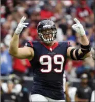  ?? ERIC CHRISTIAN SMITH — THE ASSOCIATED PRESS FILE ?? A person familiar with J.J. Watt’s condition says he has reinjured his back and the Houston Texans expect him to be out until at least December, and possibly the entire season, Tuesday.