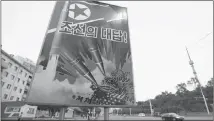  ?? JONAH M. KESSEL / THE NEW YORK TIMES ?? A propaganda poster in Pyongyang, North Korea depicts a missile striking the U.S. Capitol.