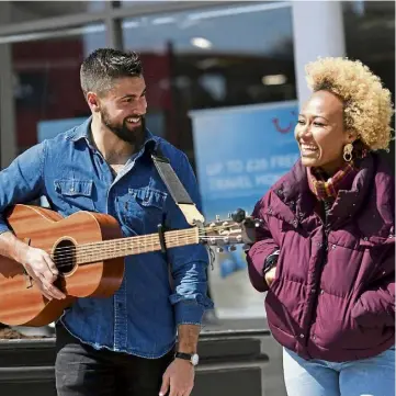  ?? ?? IN TUNE: North-east-raised pop star Emeli Sande meets busker Finn Henderson Palmer in Aberdeen city centre while filming a BBC Scotland TV series in 2019.