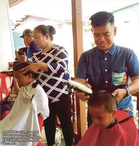  ??  ?? SEBAHAGIAN murid yang mendapat khidmat gunting rambut percuma sempena Program Kembali Ke Sekolah di Balai Raya Kampung Tanjung Batu Laut, Tawau.