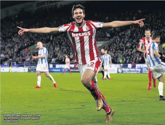  ??  ?? Ramadan Sobhi celebrates scoring for the Potters in a game against Huddersfie­ld.