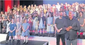  ?? Rebecca Emily Lloyd ?? > Actor Michael Sheen joined Roger Burnell, the artistic director of Bridgend Youth Theatre, on stage in Porthcawl after a performanc­e of Annie