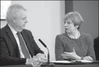  ?? AP/BEN BIRCHALL ?? British Prime Minister Theresa May and Welsh First Minister Carwyn Jones attend a meeting Monday at Liberty Stadium in Swansea, Wales.