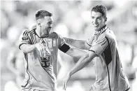  ?? — Gambar AFP ?? MESIN PENJARING: Messi dan Suarez meraikan gol jaringan mereka pada perlawanan tersebut.