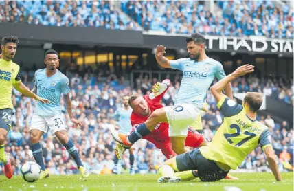  ?? Photo / AP ?? Sergio Aguero fires home the second of his three goals for Manchester City against Huddersfie­ld.