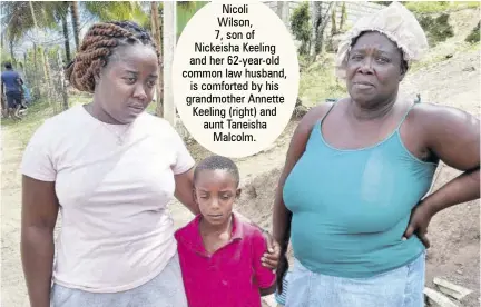  ??  ?? Nicoli
Wilson,
7, son of Nickeisha Keeling and her 62-year-old common law husband, is comforted by his grandmothe­r Annette Keeling (right) and aunt Taneisha Malcolm.