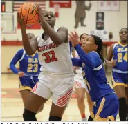  ?? (NWA Democrat-Gazette/Andy Shupe) ?? Fort Smith Northside’s Haitiana Releford (32) goes up for a shot past North Little Rock’s Arin Freeman during the first half Friday at Kaundart Grizzly Fieldhouse in Fort Smith. Releford scored six points and grabbed four rebounds during the third quarter to help Northside to a 66-53 6A-Central victory.