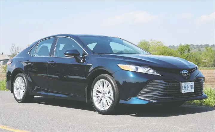  ?? PHOTOS: JIL MCINTOSH/DRIVING ?? Comfortabl­e and pleasant to drive, the popular 2020 Toyota Camry Hybrid boasts a good-looking design.