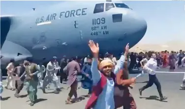  ?? SCREENSHOO­T ?? Tens of thousands of Afghans have tried to flee the country, with the rushed exit leading to sporadic firing at Kabul airport, people falling to their deaths from planes and roads paralysed with traffic.