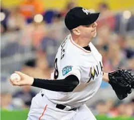  ?? MARK BROWN/GETTY IMAGES ?? Reliever Brad Ziegler of the Marlins delivers a pitch in the eighth inning of Tuesday’s game.