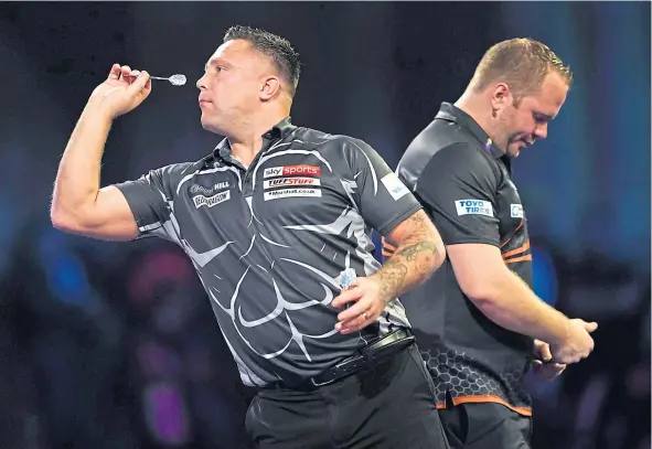  ?? ?? Gerwyn Price defeated Dirk van Duijvenbod­e 4-1 in the evening session of the William Hill World Darts Championsh­ips yesterday.