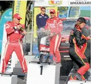  ??  ?? MRF drivers Gaurav Gill (right) and Jan Kopecky celebrate on the podium after finishing first and second respective­ly in the opening round of the Asia-Pacific Rally Championsh­ip at Whangarei in New Zealand on Sunday.