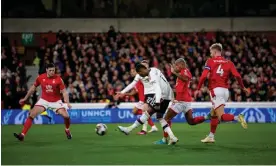  ?? Photograph: Ash Donelon/Manchester United/Getty ?? Marcus Rashford gets the better of Nottingham Forest’s defence on the way to scoring Manchester United’s opening goal.