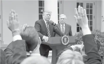  ??  ?? Trump takes questions from the media with US Senate Majority Leader Mitch McConnell at his side in the Rose Garden of the White House in Washington, US. — Reuters photo